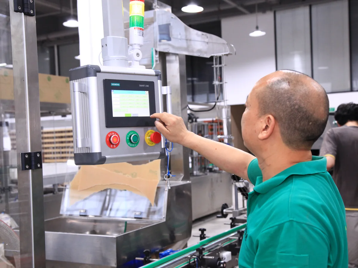 ZXSMART technician testing packaging machinery before handover